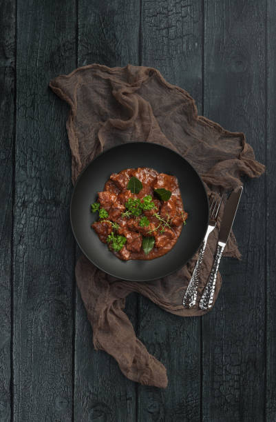 istock Homemade Goulash beef stew plate served in rustic kitchen 1351002517