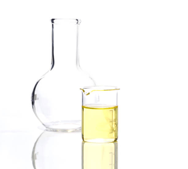 istock Cosmetic chemical ingredient on white laboratory table. Poly Aluminium chloride liquid in beaker place next to Flat Bottom Flask (Borosilicate Glass). Side View 1351003465