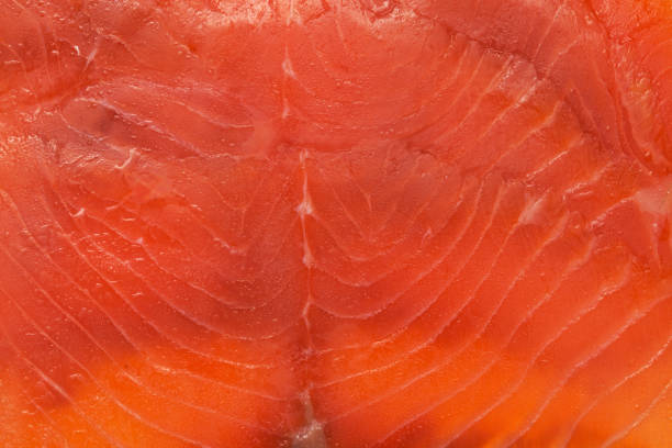 thin slices of Smoked salmon macro food background thin slices of Smoked salmon macro food background eicosapentaenoic acid stock pictures, royalty-free photos & images