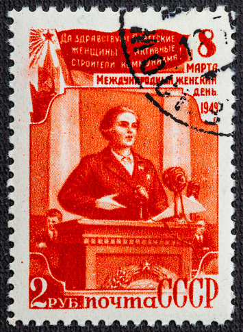 Portrait of a woman on an old postage stamp from French Indochina.