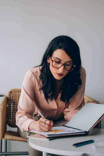 istock Beautiful Female Secretary Making a Schedule 1351009937