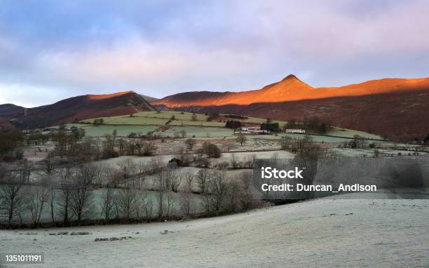 A Frost Covered Valley Of Newlands With A Winters Sunrise Catching The Mountain Top Of Causey Pike Stock Photo - Download Image Now