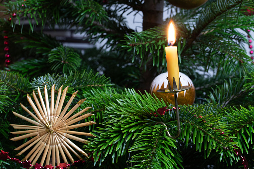 Christmas decorations and beeswax candles on the Christmas tree.