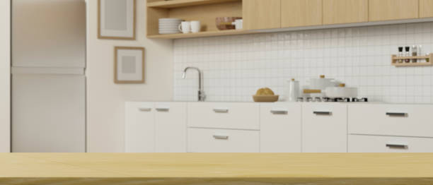 istock Wooden tabletop on blurred simple clean kitchen space interior background. 1351012248