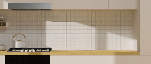 istock Mock-up space for montage on wooden cupboard in minimalist kitchen interior 1351012271