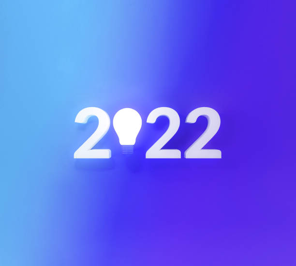 istock Idea bulb light with new year 2022 on hologram gradient background. 1351013465