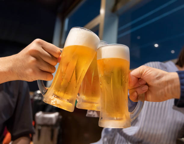 istock People toasting mug draft beer at a restaurant 1351020129
