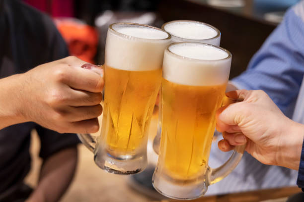 istock People toasting mug draft beer at a restaurant 1351020132