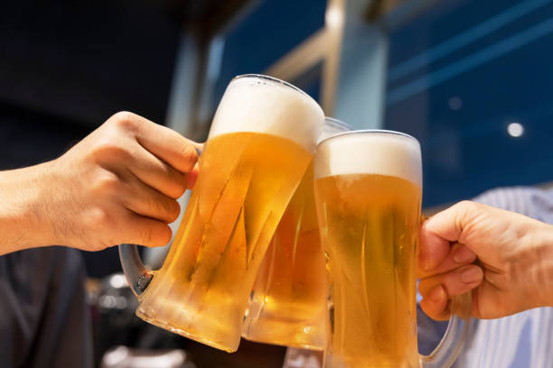 istock People toasting mug draft beer at a restaurant 1351020140