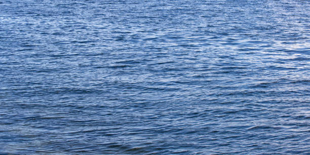 青い水の表面のテクスチャ写真 - 海の背景 - water wave water surface wave pattern ストックフォトと画像
