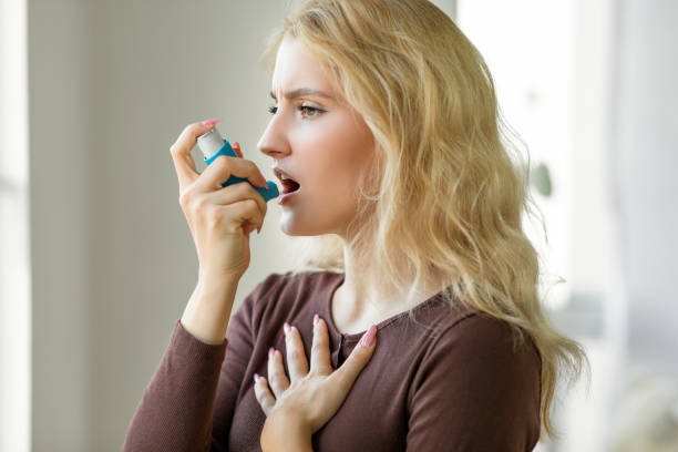 istock Woman with asthma inhaler 1351022063