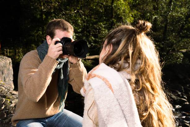 istock Young man taking portrait to woman 1351024423