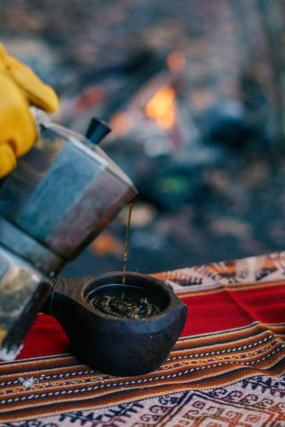 istock Man Pouring Coffee from a Moka Pot Outdoor 1351025612