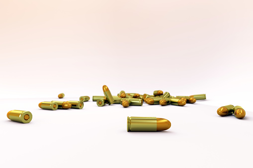 Pile of golden bullets is lying on a random on a white isolated background. Weapons-grade military bullets are lying on the floor, on a white background. 3D illustration of lying cartridges