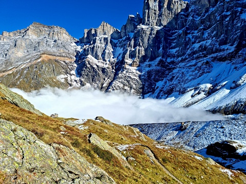 Mountains with Mist. The image shows several mountain peaks in the swiss Alps (Canton of Glarus) at an altitute of 2400m.