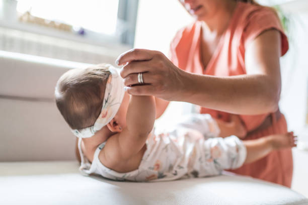 istock Mother exercising with baby 1351030590
