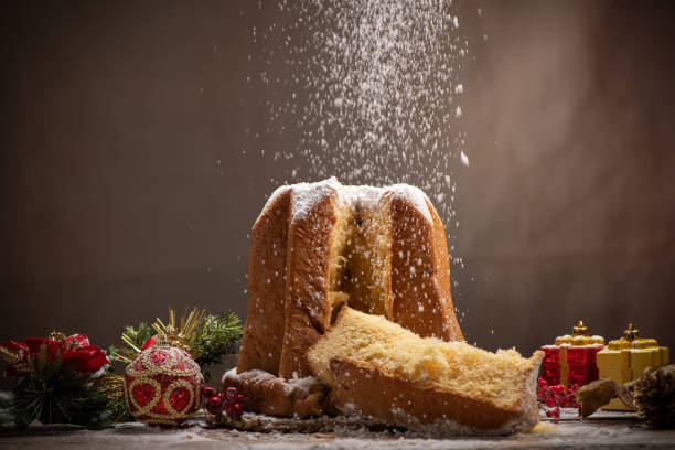 Traditional Italian Christmas cake Pandoro with christmas decoration and gifts. stock photo