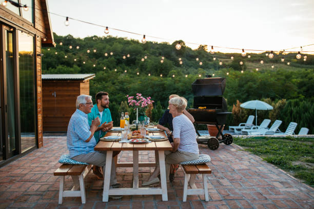 istock Affectionate family enjoying dinner during their get together in the backyard 1351036487