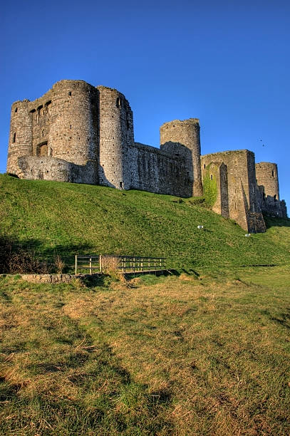 istock Kidwelly Castle and clear blue sky 135103688