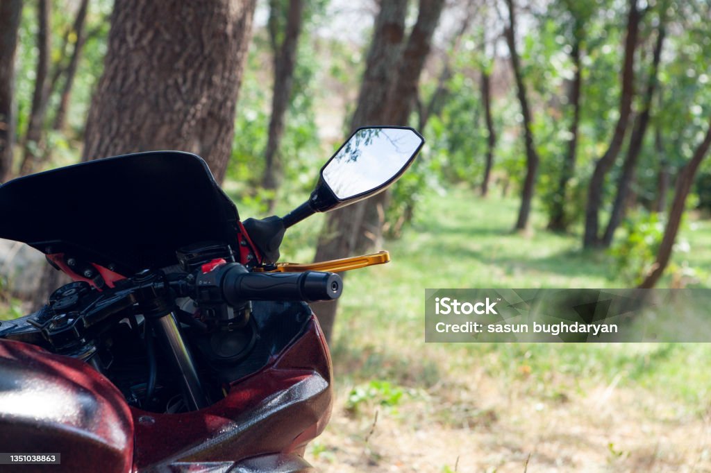 motorcycle stands in the park Adventure Stock Photo
