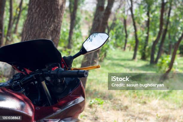 Motorcycle Stands In The Park Stock Photo - Download Image Now - Adventure, Biker, Color Image