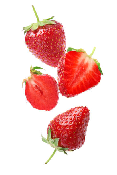istock Set with ripe strawberries falling on white background 1351039059