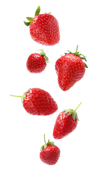istock Set with ripe strawberries falling on white background 1351039061
