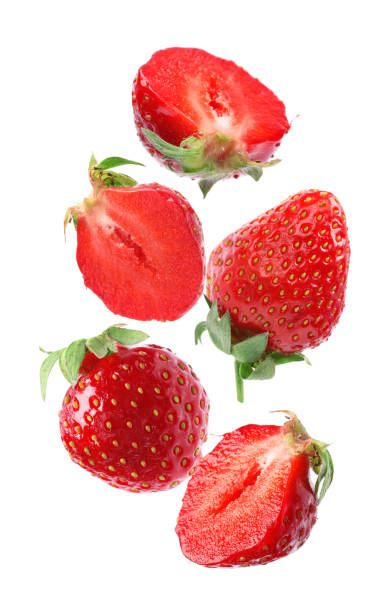 istock Set with ripe strawberries falling on white background 1351039067