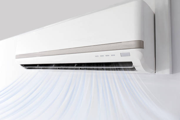 istock Modern air conditioner on white wall indoors 1351039380