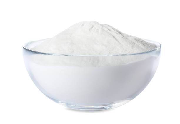 istock Baking soda in glass bowl isolated on white 1351039458