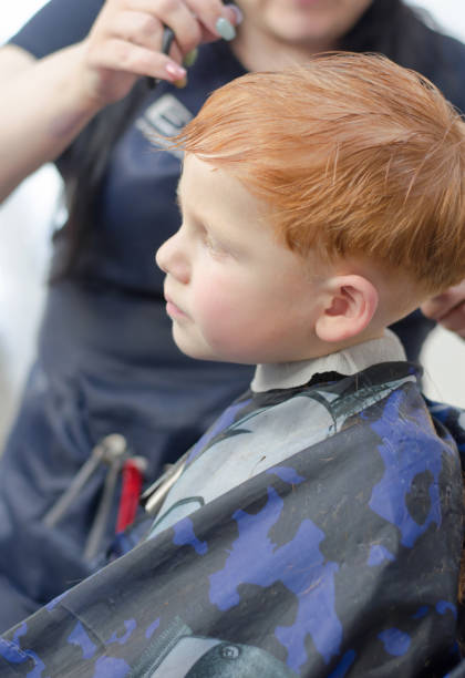 istock Redhead 4 year old boy in a barbershop 1351042080