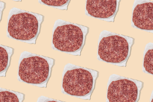 istock Burger Patty ground beef on colourful background for bbq 1351042139