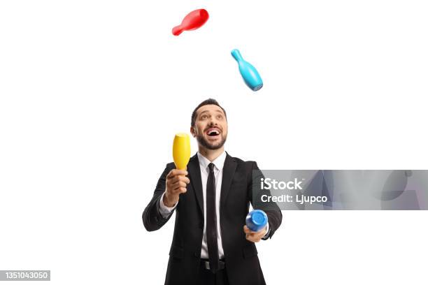 Happy Businessman Juggling With Clubs Stock Photo - Download Image Now - Juggling, White Background, Business