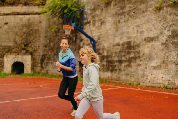 istock Mother and daughter exercise together 1351043102