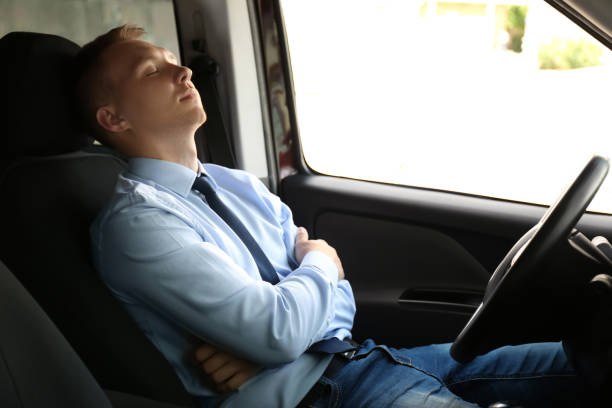 istock Tired young man sleeping in his modern car 1351043143