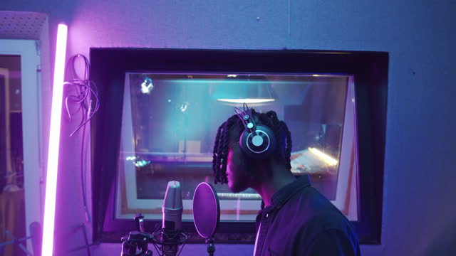 African American Singer Recording Song in Studio