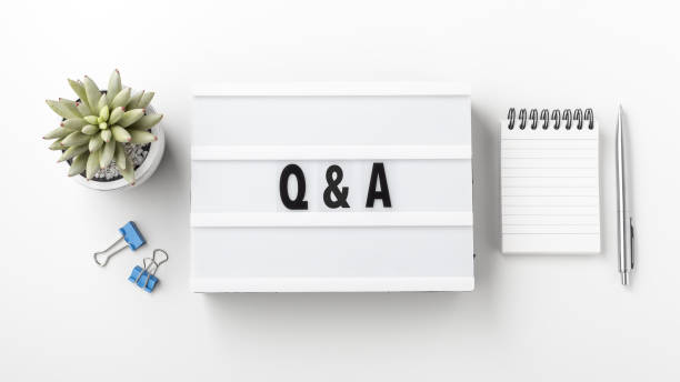 istock Q and A concept on lightbox with notebook and pen 1351043522