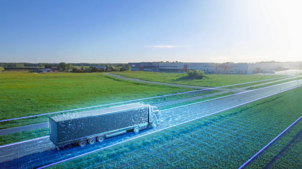 futuristic high-tech concept: big semi truck with cargo trailer drives on the road is transformed with graphics special effects into digitalized advanced autonomous truck concept. aerial drone shot - logistical imagens e fotografias de stock