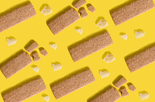 istock bright pattern with healthy snack and parmesan cheese on yellow background. 1351045682