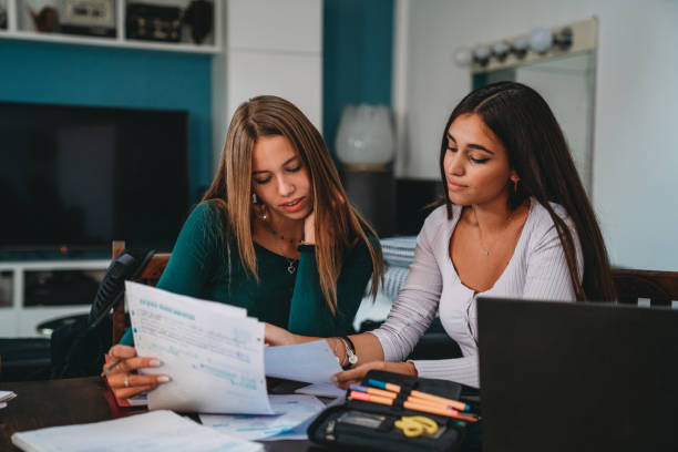 istock Friends are studying together with notebooks and laptops 1351046835