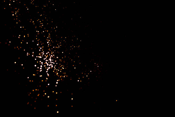 istock Golden abstract bokeh on black background. 1351047179