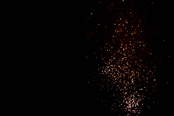 istock Golden abstract bokeh on black background. 1351047180