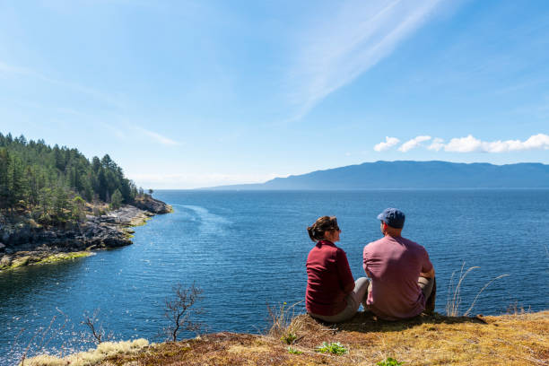 istock Hiking couple relax at viewpoint, on mountain ridge 1351048912