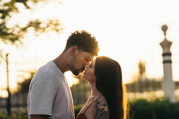 istock Young couple kissing during sunset 1351051322