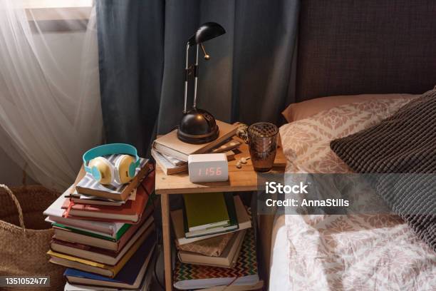 Bed Table With Alarm Clock Stock Photo - Download Image Now - Stack, Book, Night Table