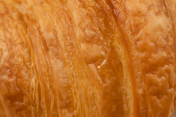 Fresh And Tasty Croissant With Honey Topping Close Up