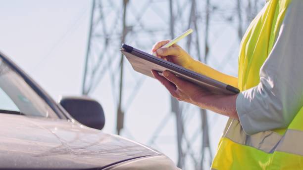 istock High voltage female engineer working on the field. 1351057602
