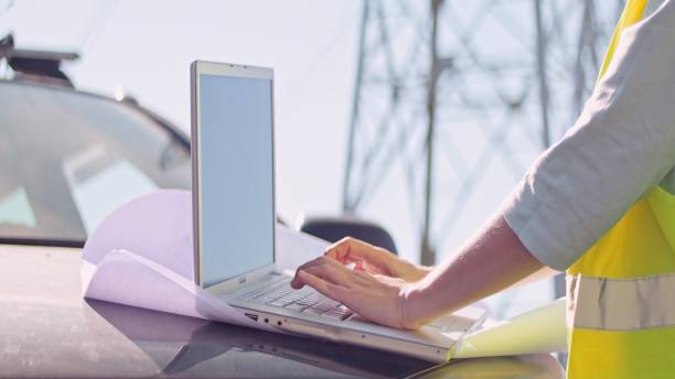 istock High voltage female engineer working on the field. 1351057603