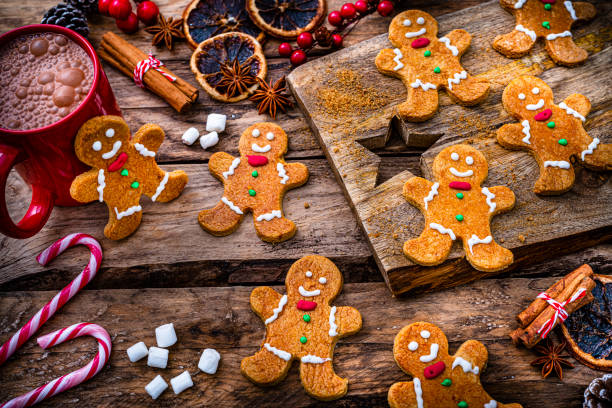 istock Christmas gingerbread man cookies on wooden table 1351059537