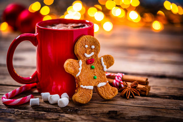 istock Hot chocolate and gingerbread cookie on Christmas table 1351059550